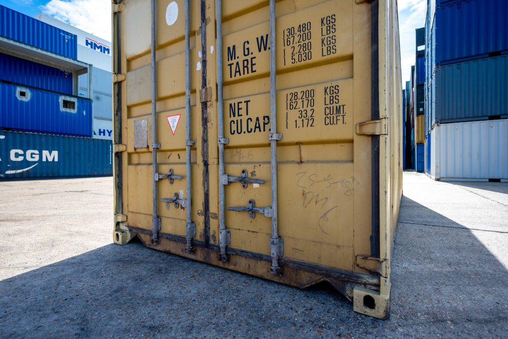 Second-hand 20ft shipping container in depot.